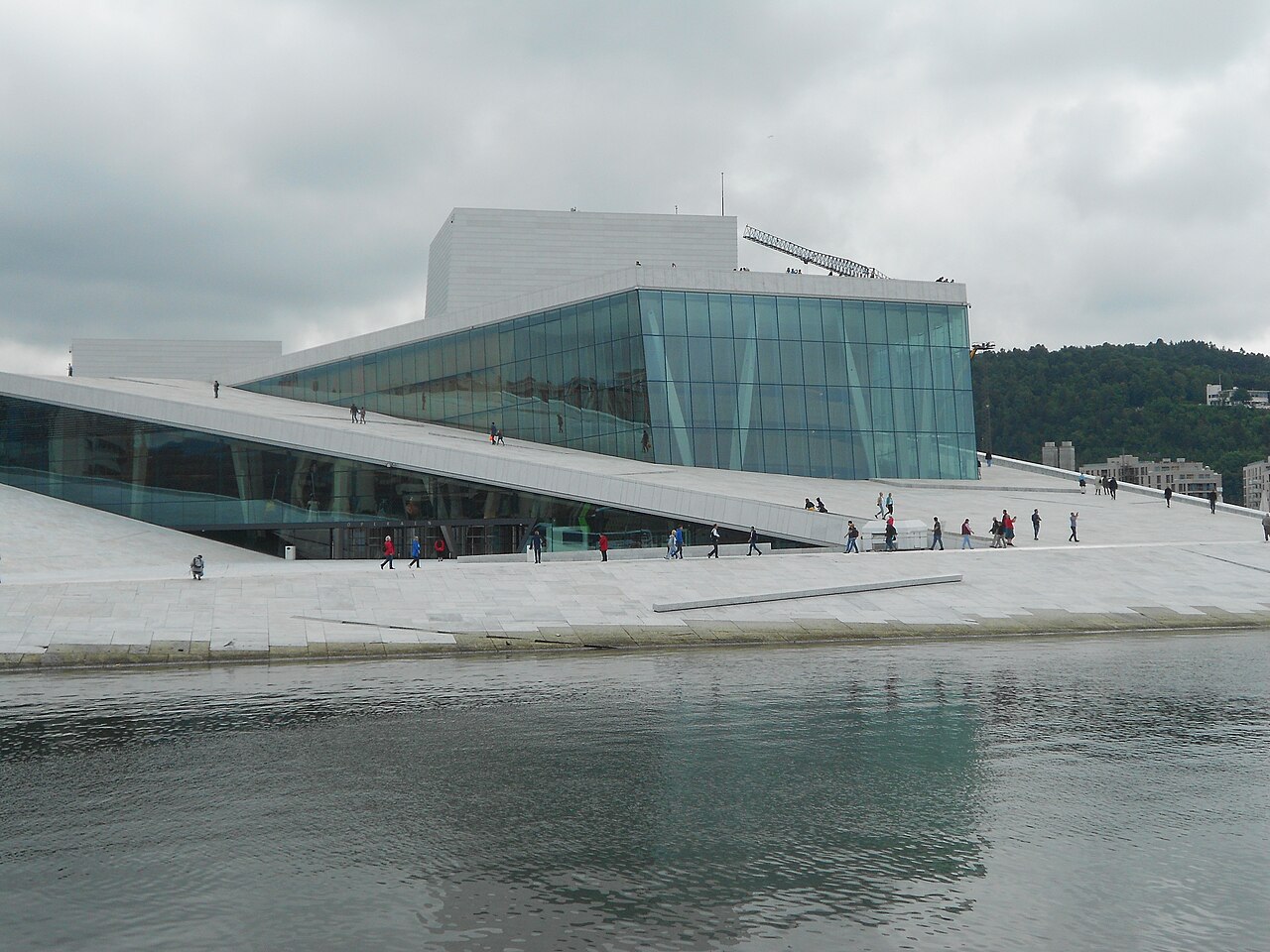 Visitors walking up the Oslo Opera House roof